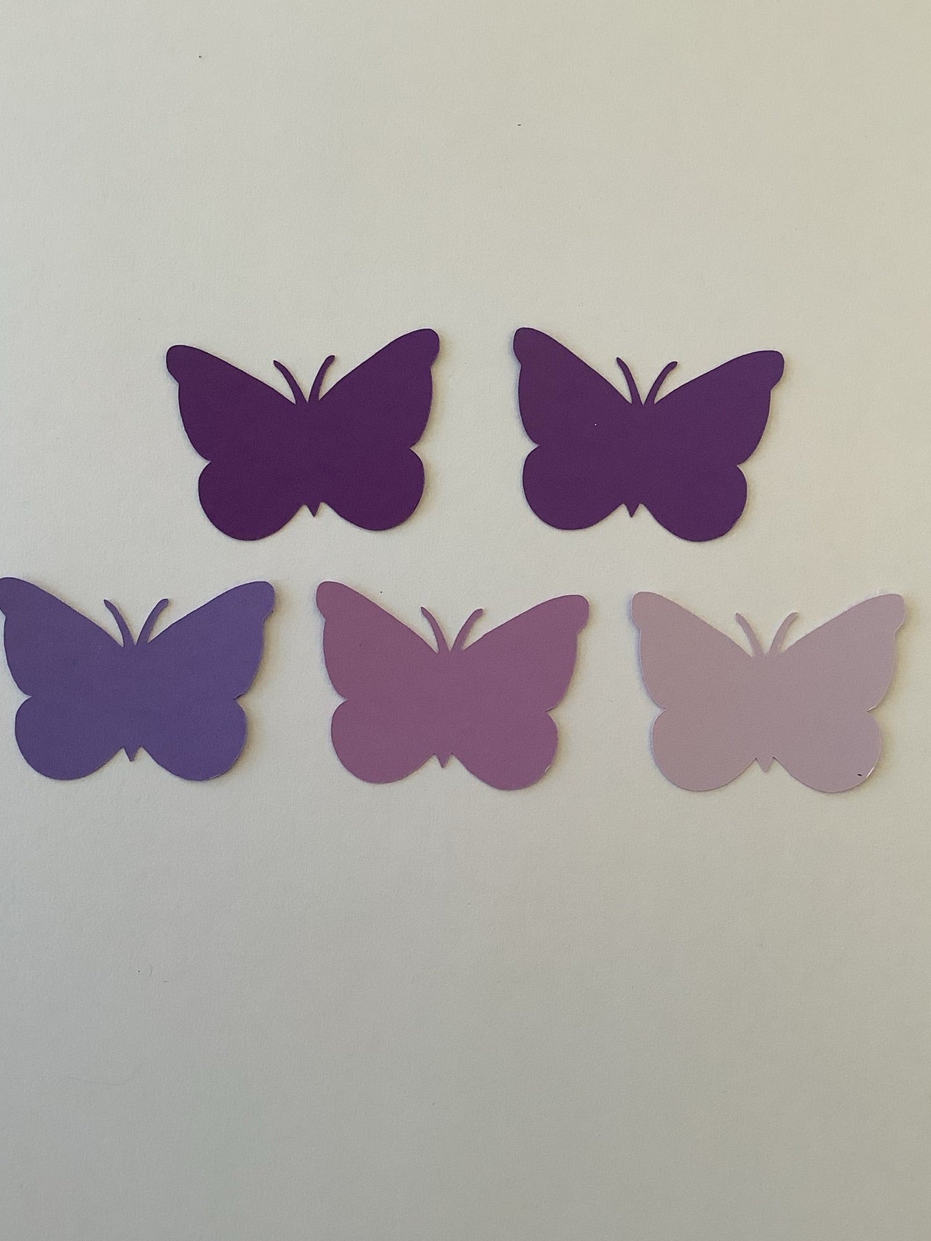 Set of 50 purple 2-inch cardstock butterfly die cuts in five beautiful shades of purple. Perfect for scrapbooks, baby showers, card making, junk journals, and party decorations.