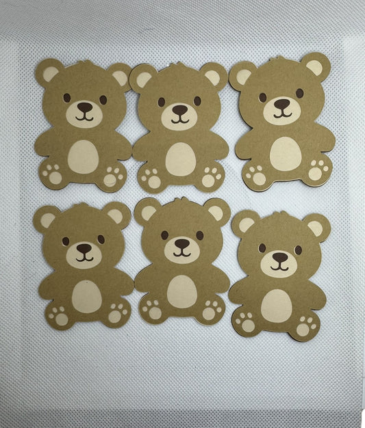 Set of six brown teddy bear cardstock die cuts arranged on a white background for baby shower decorations and paper crafts